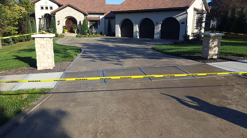 concrete sealing just laid on a driveway