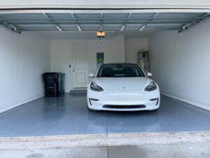 Epoxy garage floors under a vehicle